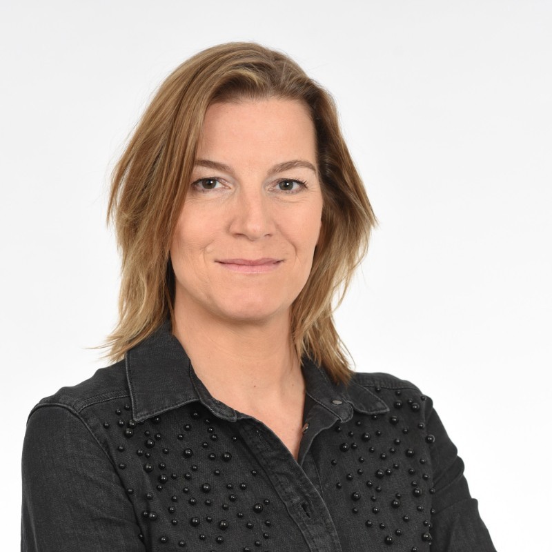 Portret van Judith Boom van Goldman Sachs Asset Management tegen een witte achtergrond.