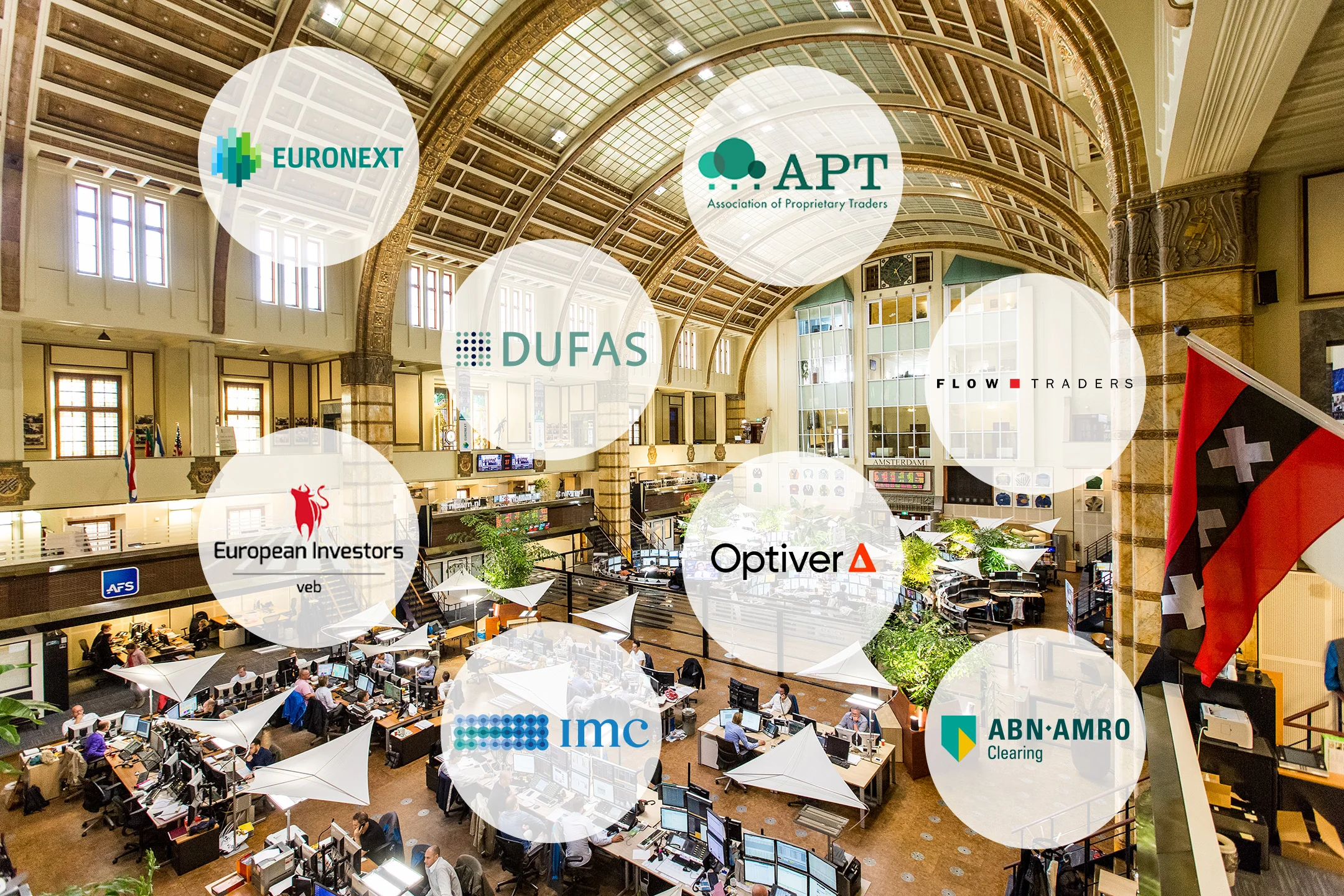 Interior view of the Euronext building with various company logos displayed.
